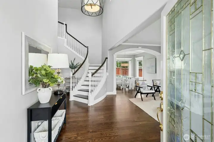 Grand staircase. Inviting entry.