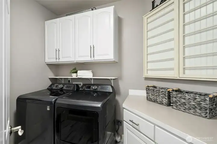 Laundry room with lots of extra storage.