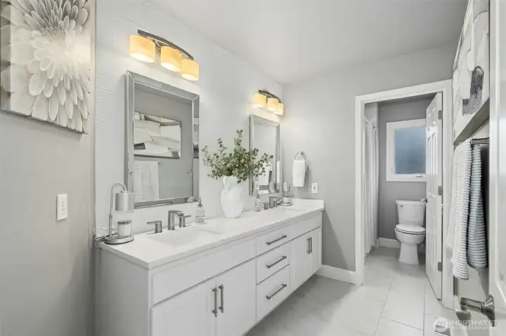 Refined, contemporary bath with a calm, nuetral palette.