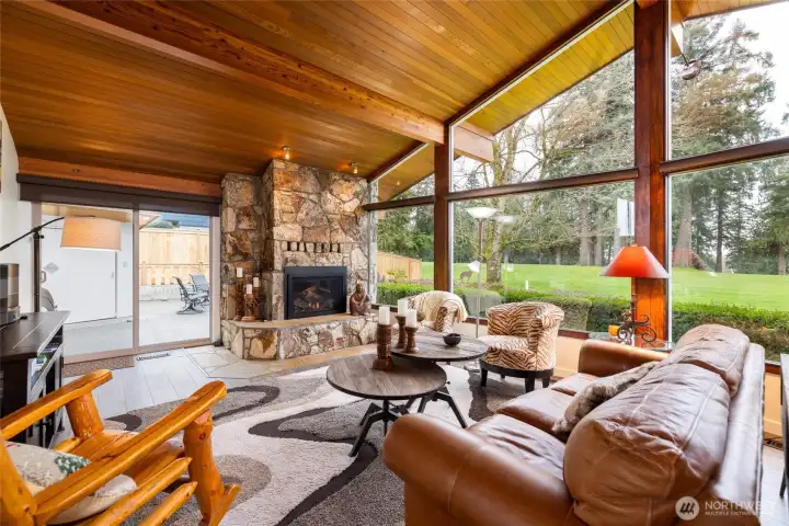 A gas fireplace and cedar-lined ceilings give this room a warm, comfortable feel.