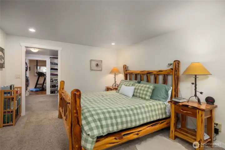 Primary bedroom with walk-in closet and exercise room to the left.