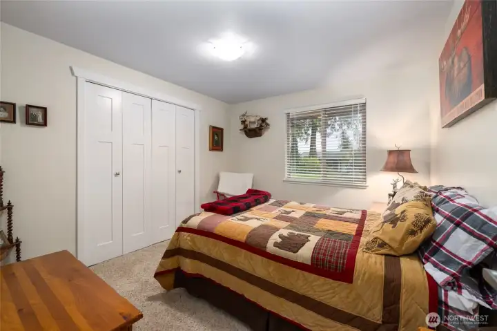 Third bedroom with closet organizer.