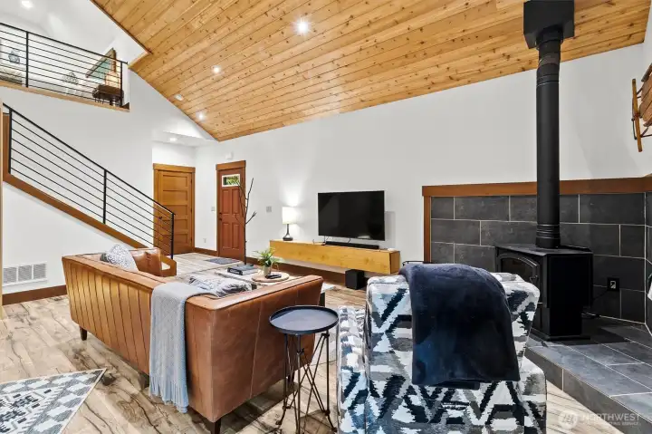 Living room and staircase to loft.