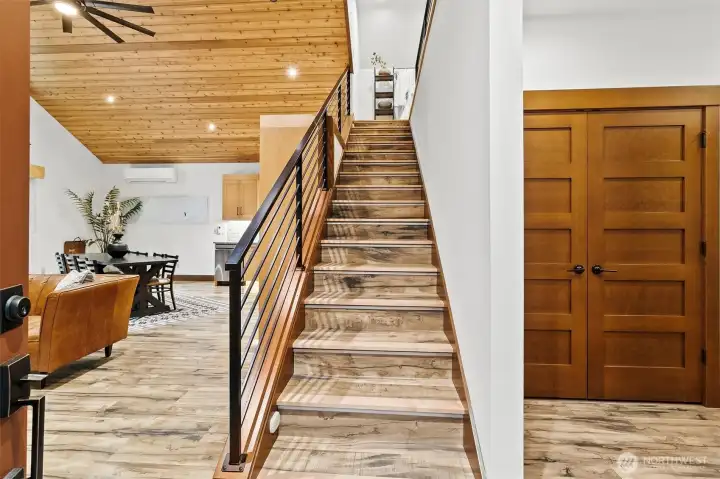 Entry and staircase with open-concept layout.