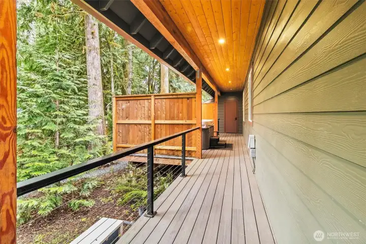 Covered side deck leading to private outdoor amenities.