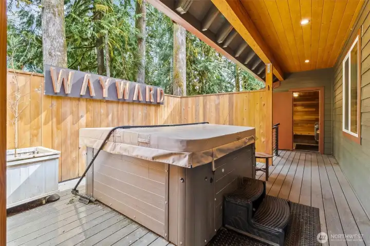 Hot tub just steps from dedicated sauna space for a true retreat experience.