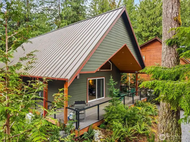 Durable metal roof and clean modern lines complement the natural surroundings.