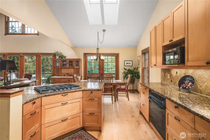 Kitchen Open to Dining and Living Areas - Maple Floors throughout Main Level Living Area