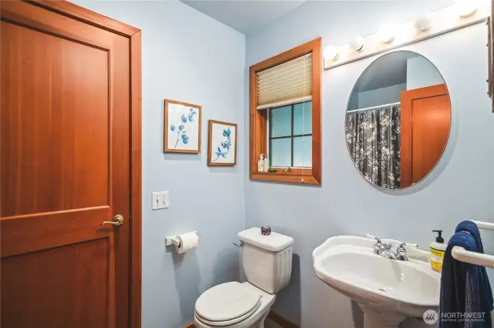 Guest 3/4 Bath located between Entry and Laundry Porch