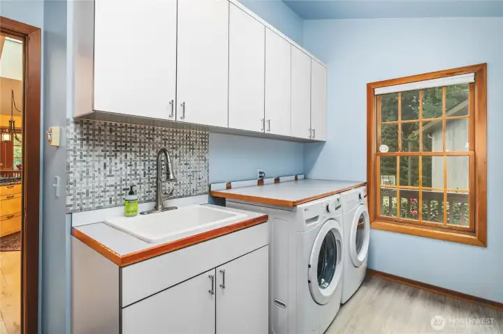 Convenient Laundry Room has its own outside door for easy access in from yard or bringing groceries to kitchen from garage