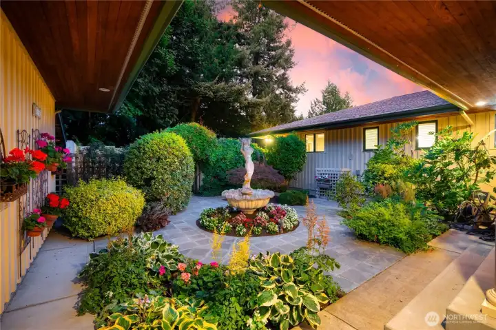 Gorgeous, lush, and a hidden oasis through the archway in the back.