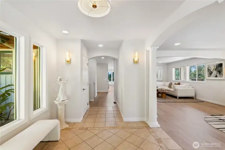 This view is from the double glass front doors.  There's a coat closet down the hallway on the left and a built-in shoe storage cabinet on the right.