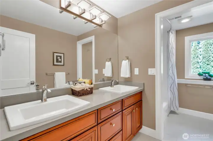 uuest bath could easily have a door added to divide the shower from the countertop area.