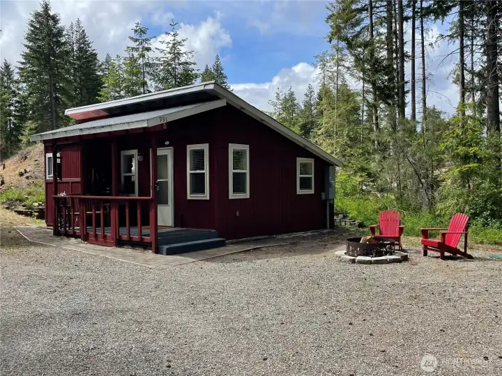 Adorable cabin nestled into the back of the property for ultimate privacy and flexibility for future building.