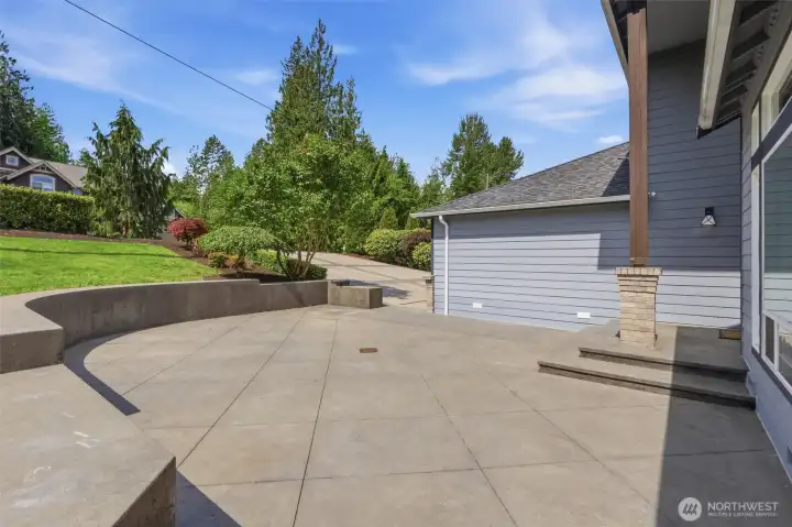 Impressive 3 bay garage with room for vehicles, storage, & workshop space.