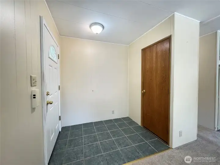 Entryway of home and coat closet.
