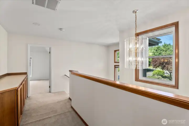 upstairs hall with storage cabinet