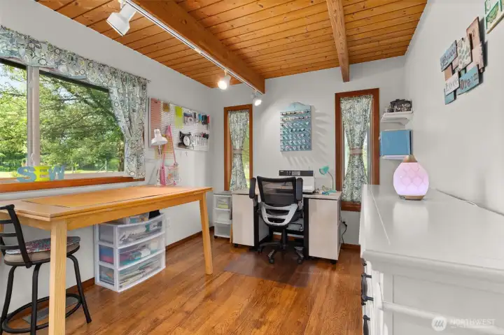 Downstairs den/office, currently used as a sewing and craft room. Down stairs. Downstairs den/office, currently used as a sewing and craft room. Down stairs.