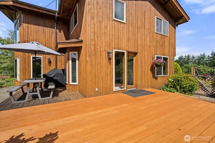 Large deck wraps around east and south sides of house. Door leads to dining room. Large deck wraps around east and south sides of house. Door leads to dining room.