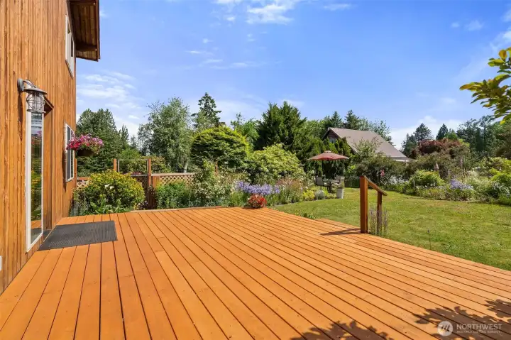 Deck space on east side of house. There is a door that leads into the dining room (hard to see in photo). Deck space on east side of house. There is a door that leads into the dining room (hard to see in photo).