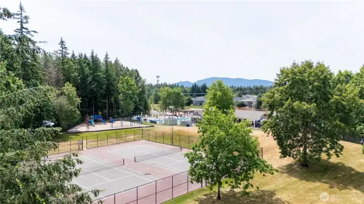 A vibrant community setting featuring recreation facilities, open spaces, and gathering areas designed to support an active and engaging lifestyle throughout the year.