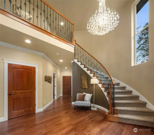 Stunning staircase leading upstairs to 5 bedrooms, second laundry room and bonus room