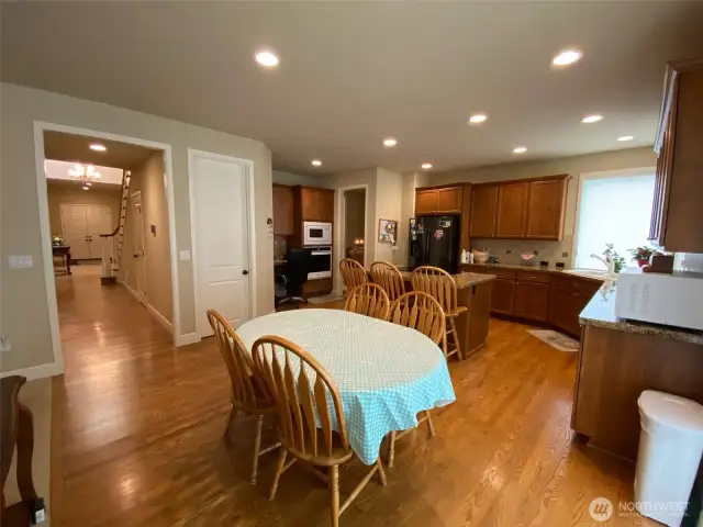 Photo taken by Seller prior to Tenant Occupancy.  Kitchen nook eating space with door to walk in pantry visible next to the island