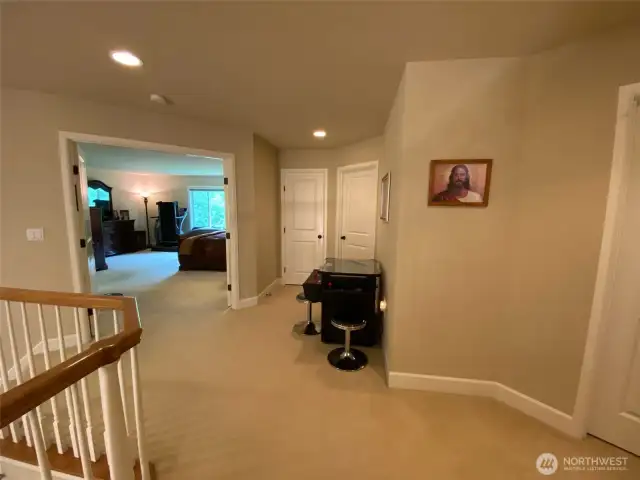 Photo taken by Seller prior to Tenant Occupancy.  Primary suite with French doors off the top of the stairs