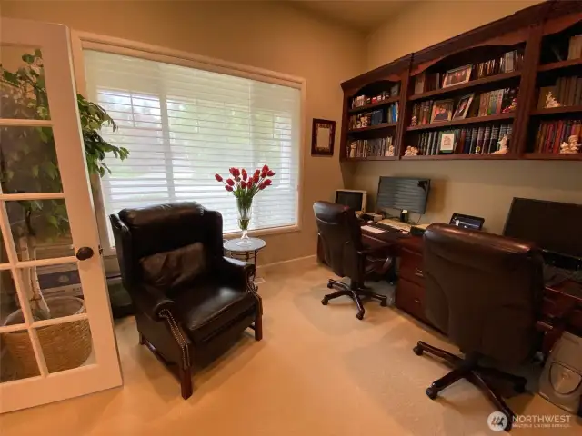 Photo taken by Seller prior to Tenant Occupancy.  Custom built in desk and shelving in the home office