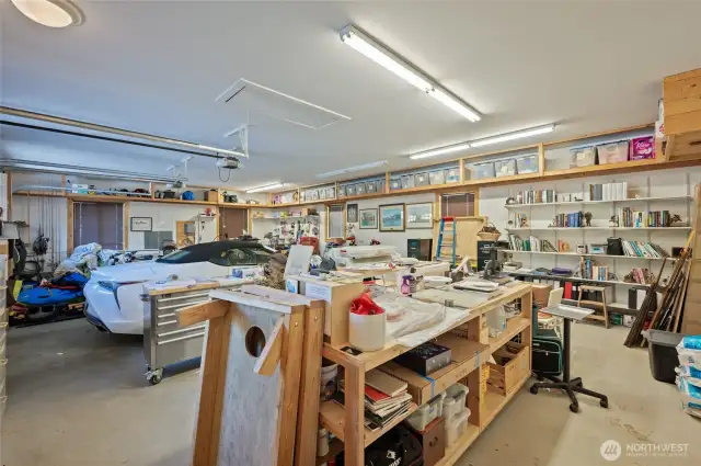 Oversized garage 25'x 39' Insulated, Hot and Cold Water Extra 20 Amp, Shelving, Stairs to attic, 5 Windows for natural light