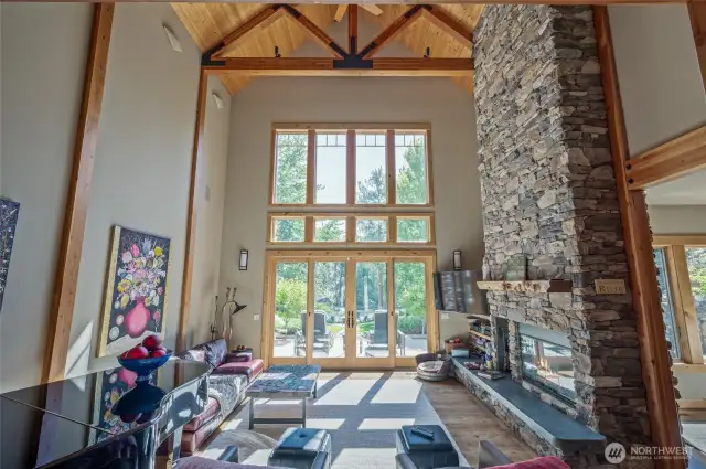 28' Soaring ceilings with double sided gas fireplace, sound system and french doors exiting to expansive rear terrace and dining veranda