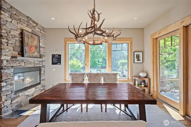 Dine with the elk horn chandelier with your gas fireplace