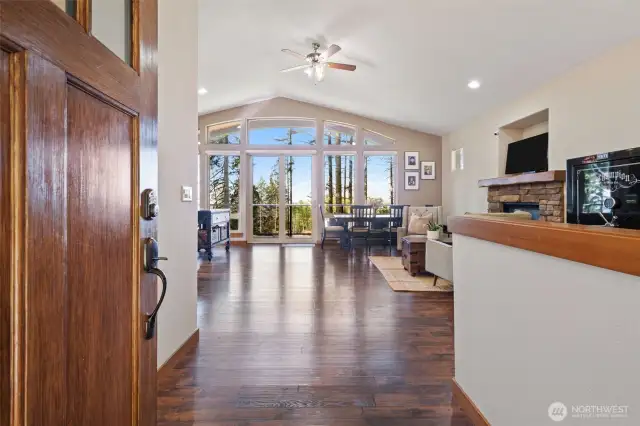 Enter into home and you'll be greeted with laminate flooring throughout, vaulted ceiling