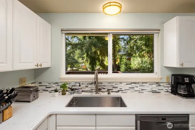 New countertops, sink, and appliances.