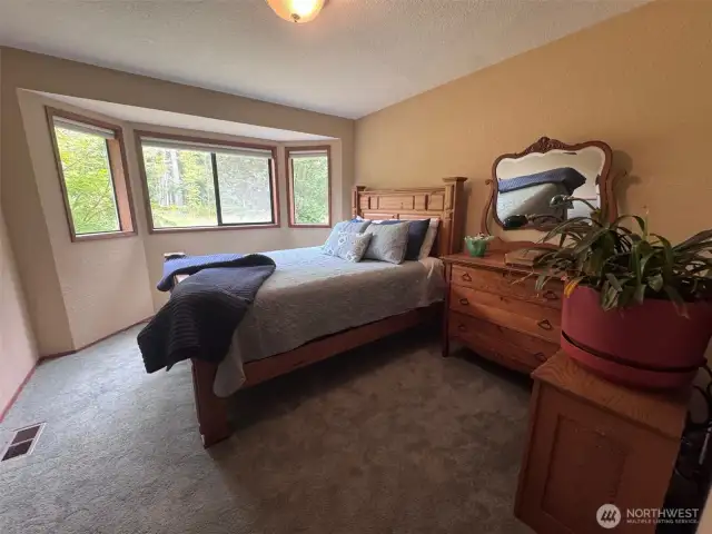 Guest Bedroom #1 has a walk-in closet and a bay window.  Plenty of room for a queen size bed.