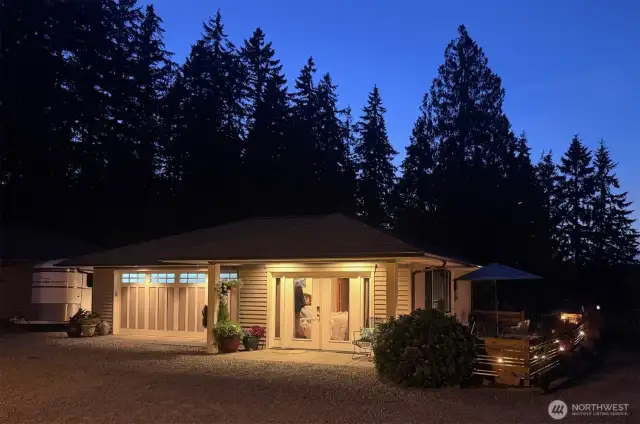 The Cottage with it's lovely patio and attached garage with a full attic, easily accessed and heated floors for your collector car.