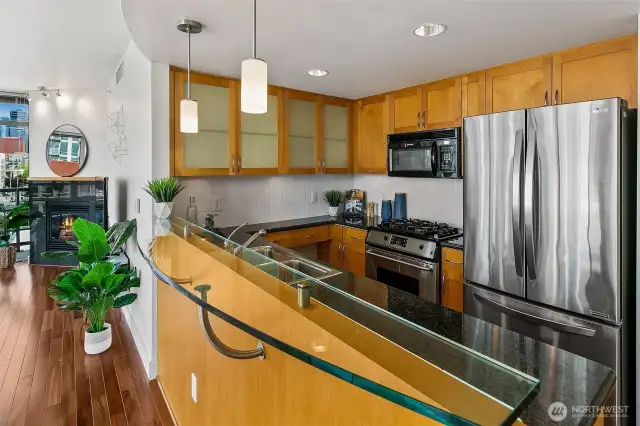 Kitchen is open to the dining. Lots of cabinet storage and counterspace.
