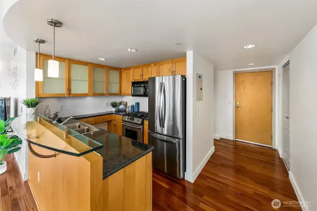 The layout has the living space on one side, and the private spaces; bedrooms/bathrooms on the other side.