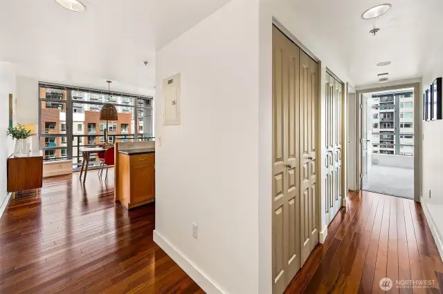 The layout has the living space on one side, and the private spaces; bedrooms/bathrooms on the other side.