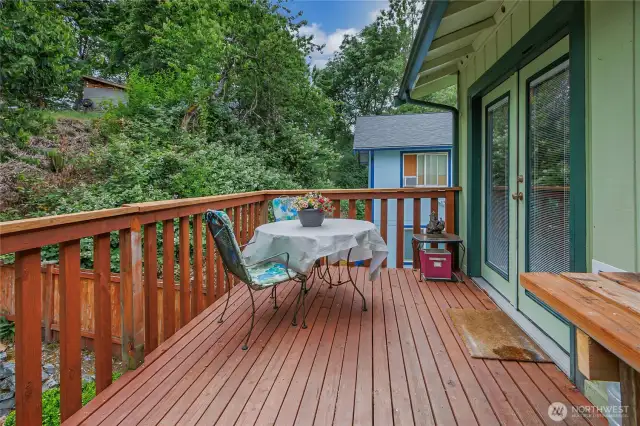 Upper deck opens through French doors off the dining area, creating a seamless indoor-outdoor flow perfect for entertaining or relaxing.