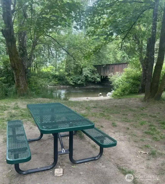 Located just moments from the home, enjoy a peaceful riverside setting with a favorite local swimming hole and picnic tables—ideal for sunny days, outdoor meals, and a quick escape into nature.