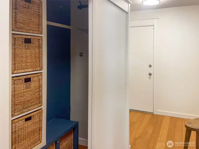 Storage space to the right of the washer/dryer. Front door is on the right. Door in the picture goes to the two-car garage.