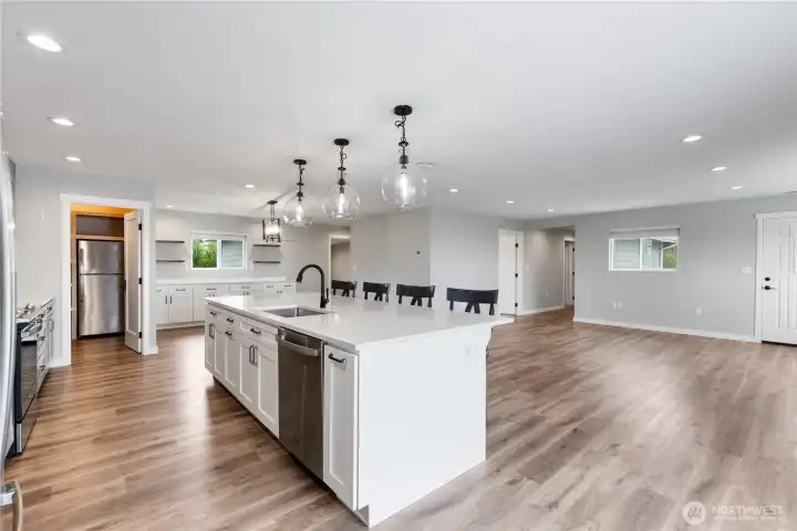 Great room with eating island, living and dining room