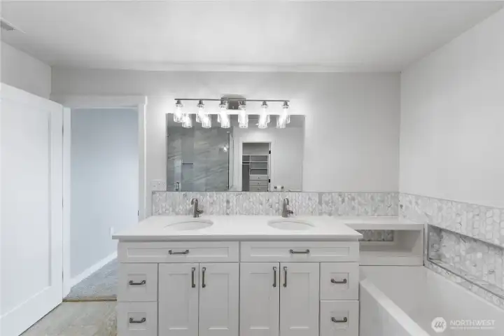 Primary bathroom leads to large walk-in closet
