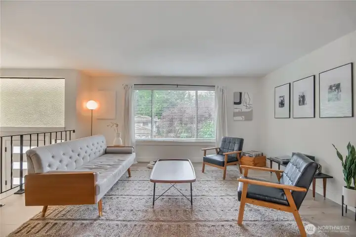 Inviting living room with tons of natural lighting.