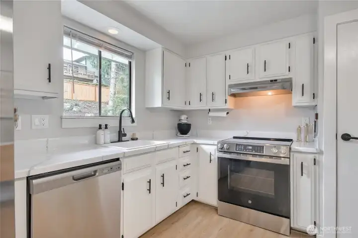 Kitchen overlooks back yard.