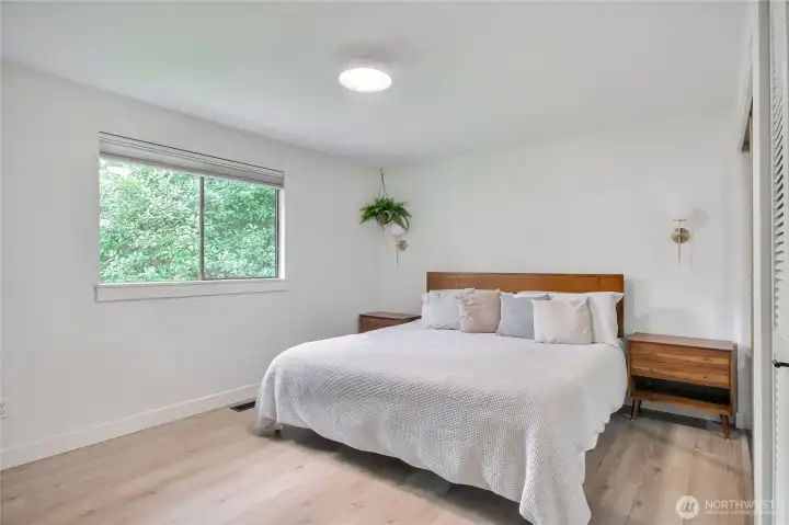 Primary bedroom with two closets and private bathroom.