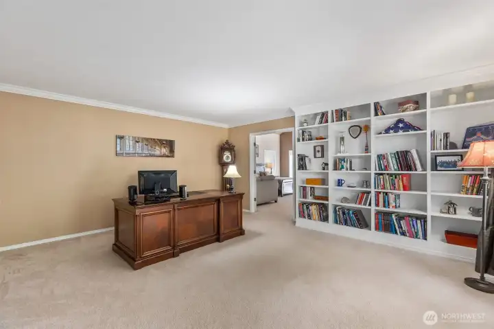 Now, this is an office!  Located between the living room and primary suite, this wing of the home is the perfect, private sanctuary needed for work from home, or just unwinding