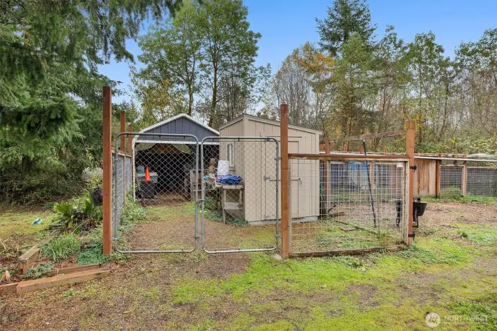 Additional outbuildings offering versatile storage or workspace