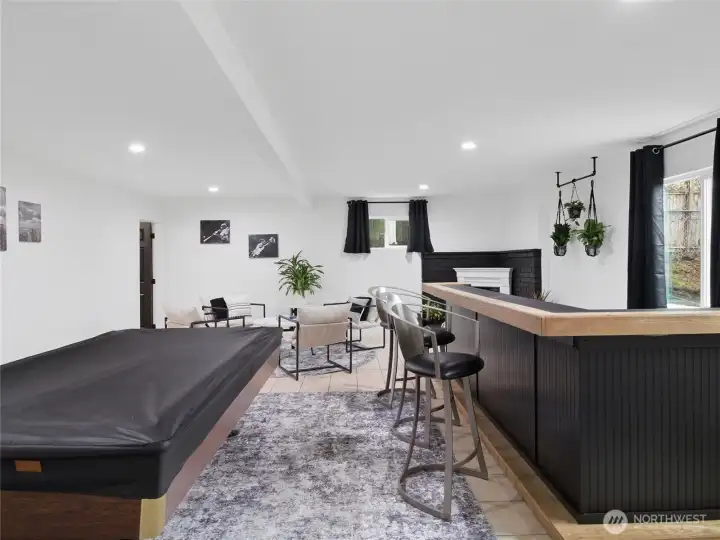 Basement w/ bar and water connected.